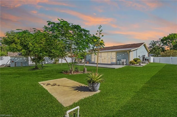 Yard at dusk with a patio