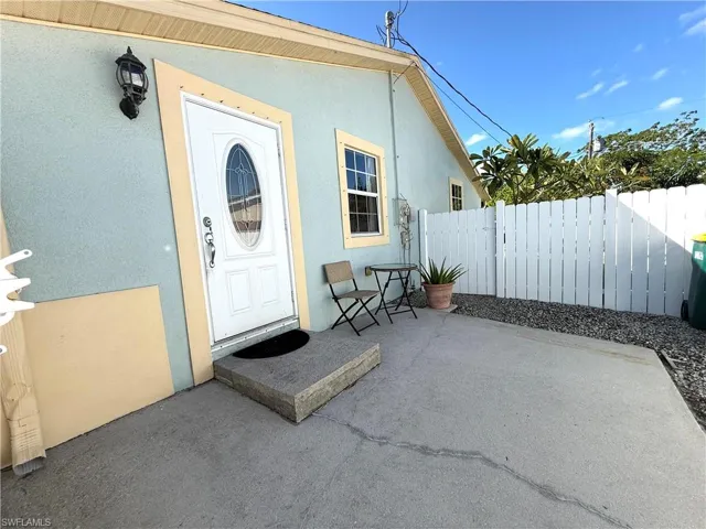 View of exterior entry featuring a patio area