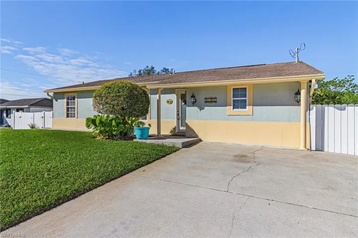 View of front of property with a front lawn