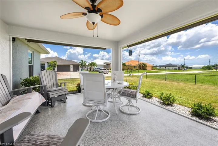 View of patio featuring ceiling fan