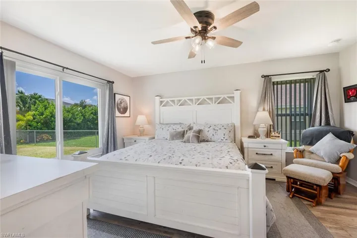 Bedroom featuring ceiling fan and light hardwood / wood-style floors