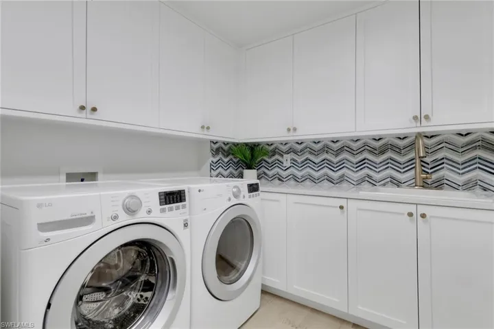 Laundry area with cabinet space and independent washer and dryer