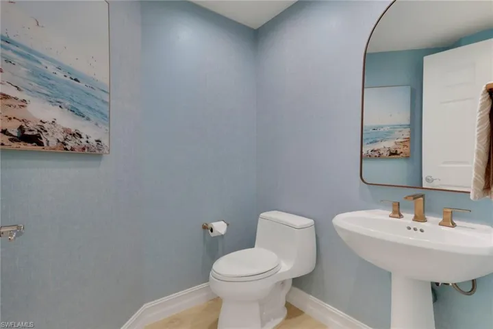 Bathroom with toilet and tile patterned floors