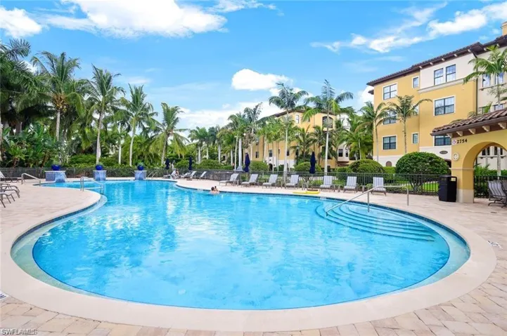 Community pool with a patio area