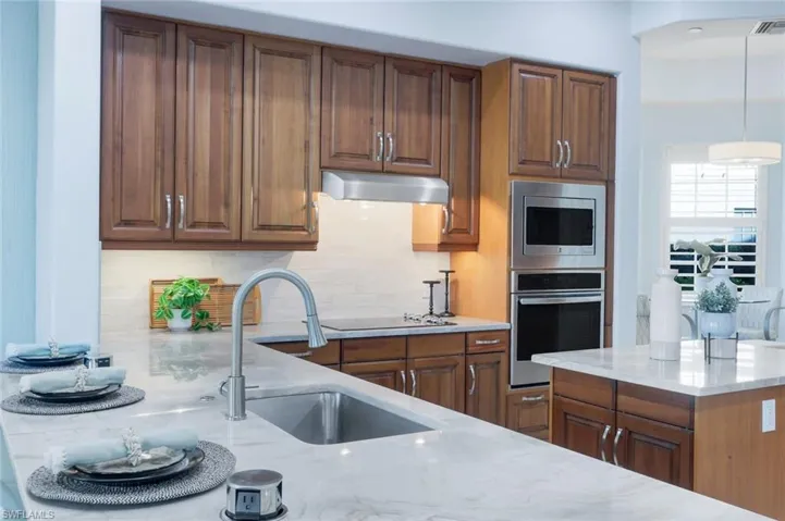 BEAUTIFUL WOOD CABINETRY AND EXTRA STORAGE IN CENTER ISLAND