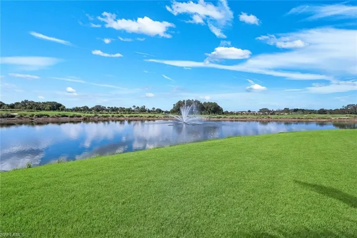 LOTS OF GREEN SPACE IN REAR OF LANAI WITH VIEW OF FOUNTAIN