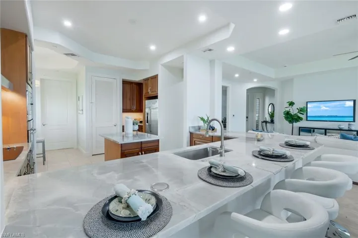 BREAKFAST BAR WITH SEATING FOR FOUR; EXQUISITE COUNTERS