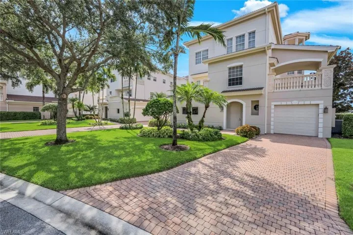 PRIVATE DRIVEWAY ON END OF BUILDING WITH SPACIOUS DRIVEWAY FOR GUEST PARKING