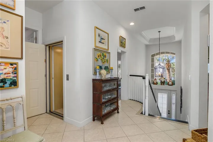 Second floor entry to unit with private elevator door open to left.