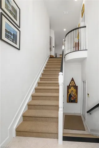 Front entry from lower garage door to landing and carpeted stairs to second floor. This unit has a private elevator from 2 car garage to second floor living area. Easy to transport grocery bags and vacation luggage.