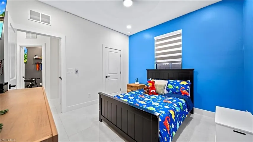 Bedroom featuring baseboards and ceiling fan
