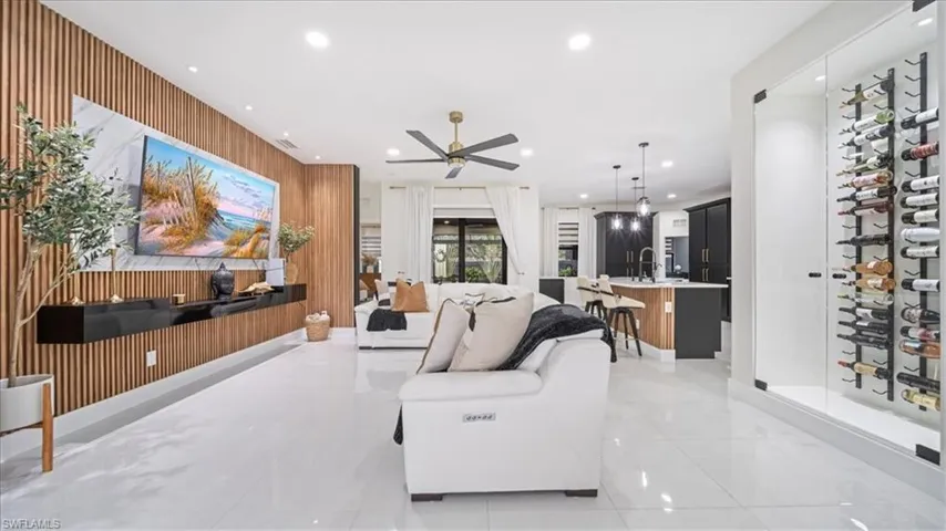 Living area with wooden walls and recessed lighting