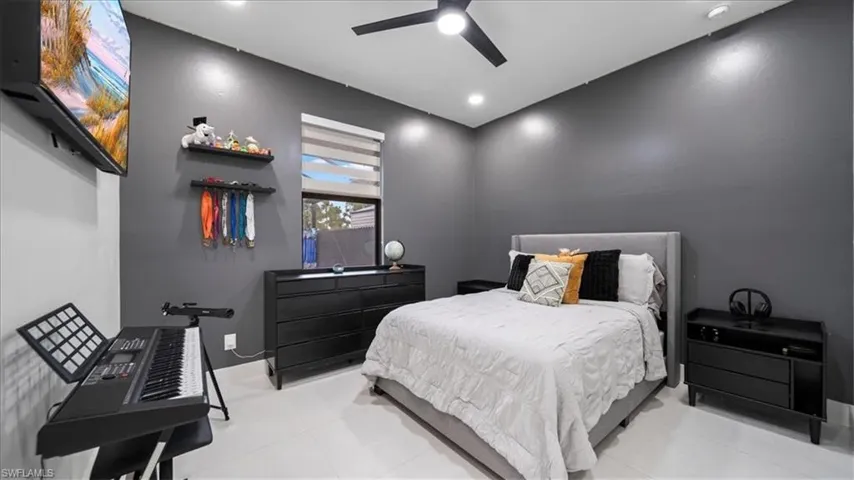 Bedroom featuring a ceiling fan and light tile patterned floors