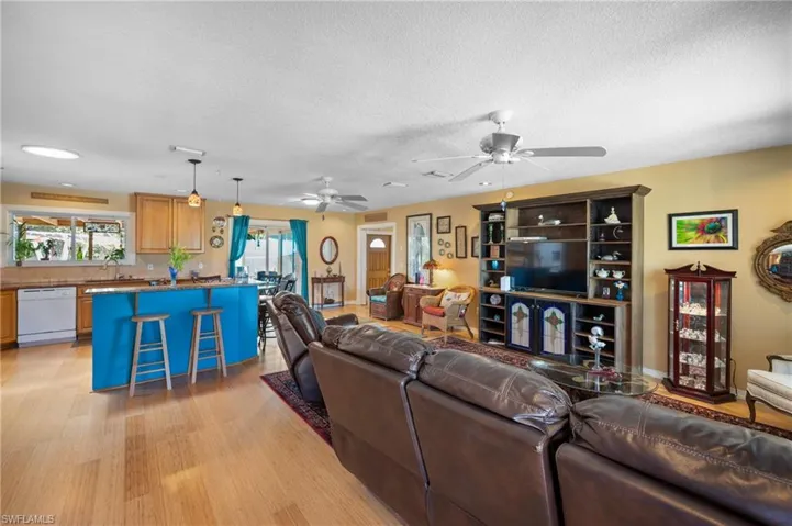 Open-concept living area with wood-finish flooring