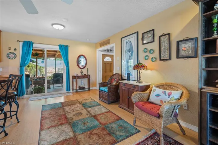 Wood-finish flooring throughout, with a ceiling fan