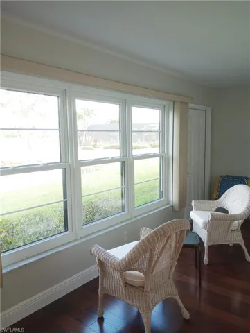 View of Screened & heated pool, the pond and the golf course