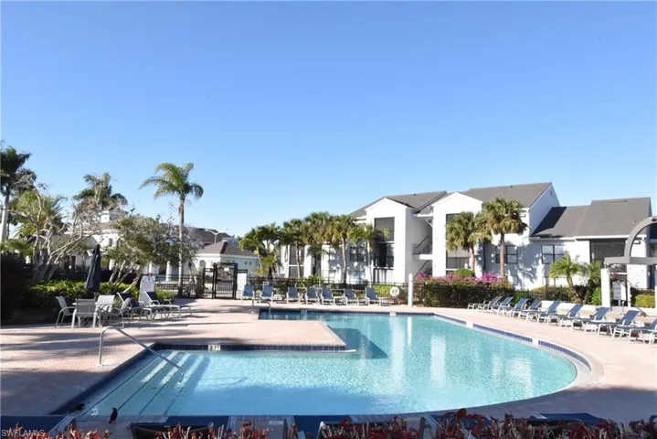 Community pool with a patio