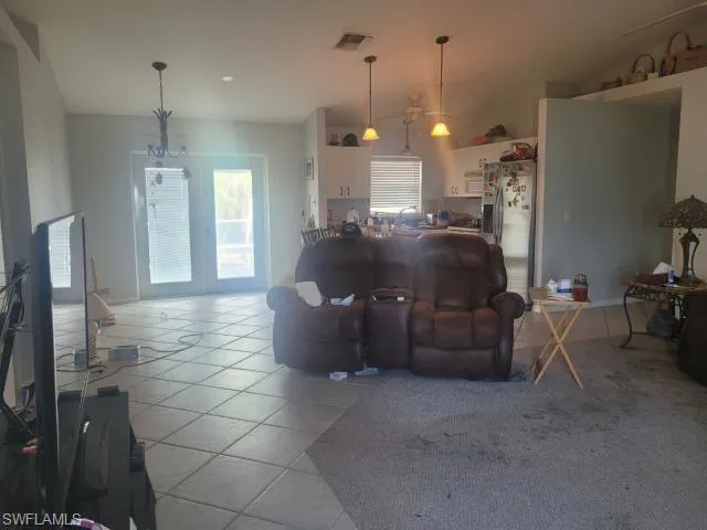 Living room featuring light tile patterned floors