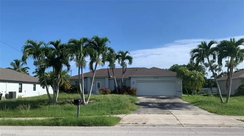 Single story home featuring a garage