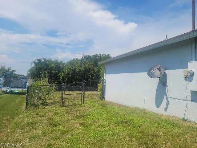 View of yard with a trampoline