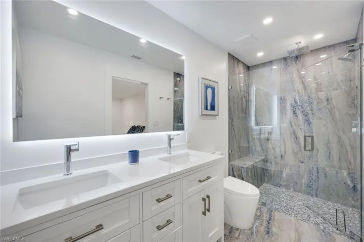 Stunning blue and earth tone porcelain tile in shower