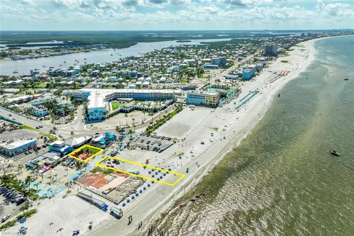 Aerial view featuring a view of the beach and a water view