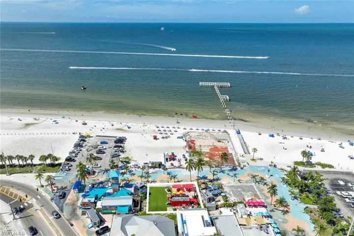 Aerial view with a water view and a view of the beach