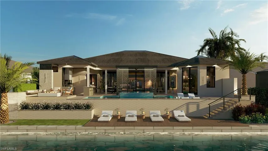 Rear view of house with a patio, an outdoor pool, roof with shingles, and outdoor furniture