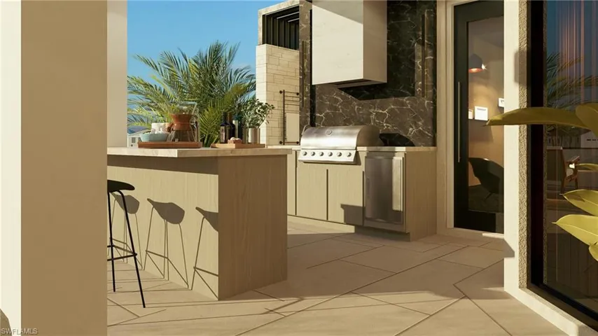 View of patio featuring exterior kitchen