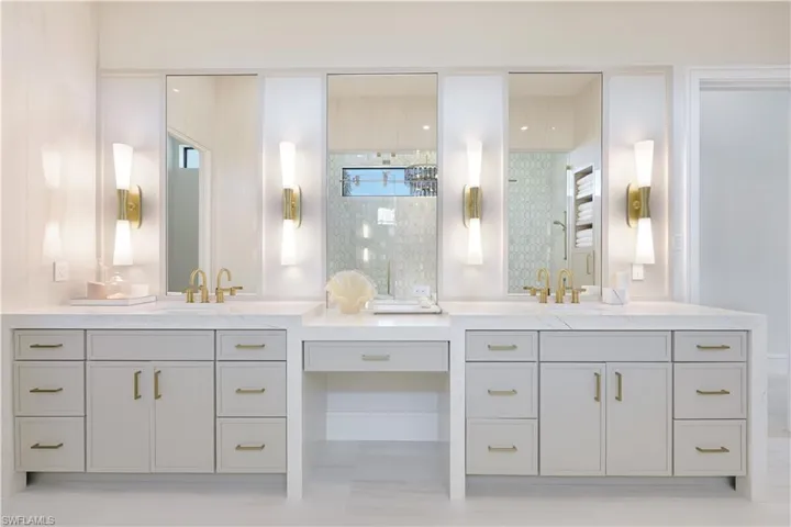 Bathroom featuring two vanities