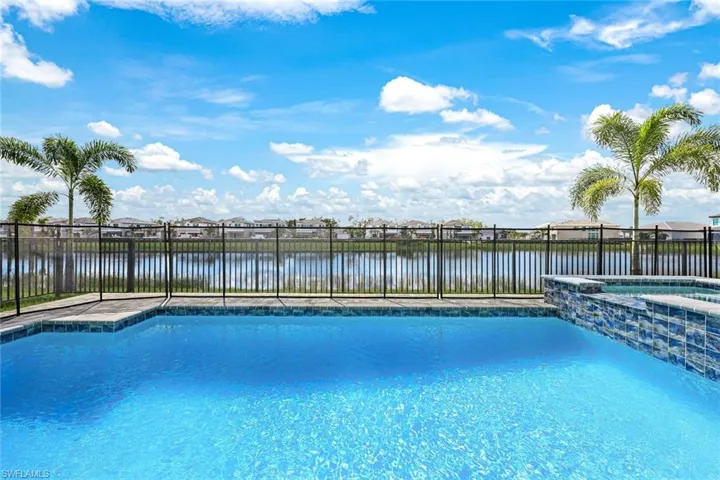 View of pool with a water view
