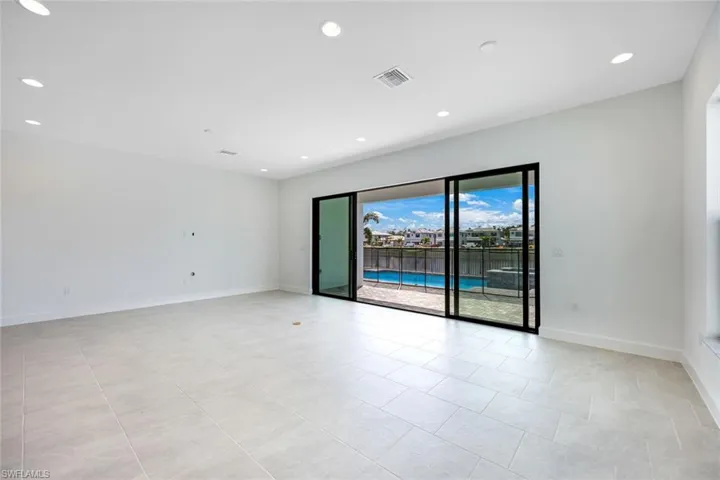 Spare room featuring light tile patterned floors