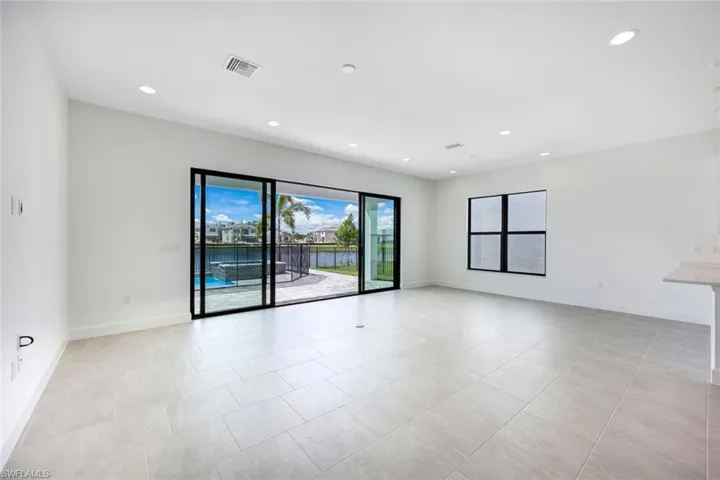 Spare room featuring light tile patterned flooring