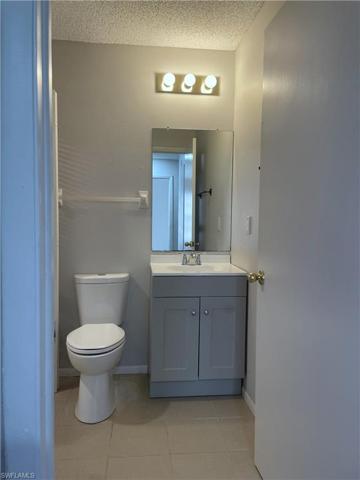 Half bath with new vanity and Laundry room closet