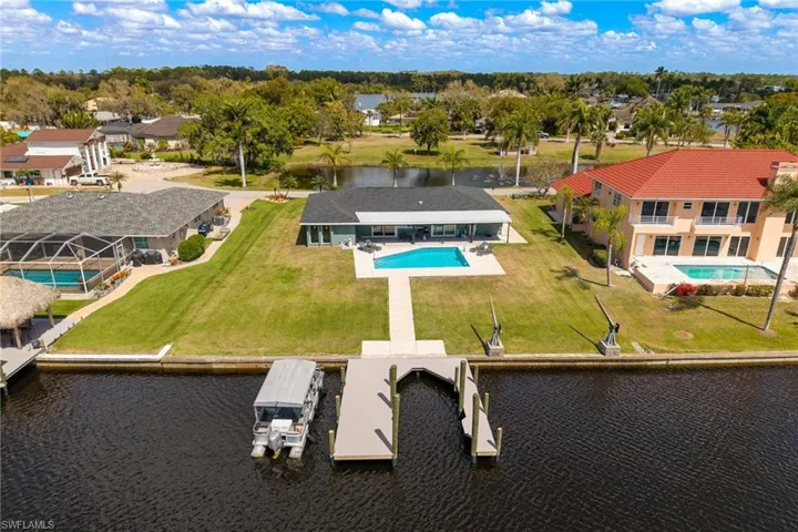 Aerial view of a nearby body of water and a pool