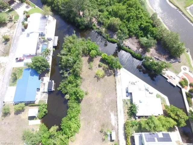Aerial overview of property's location featuring a nearby body of water