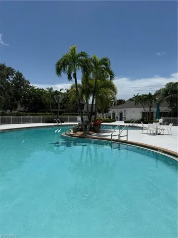 Community pool featuring a patio