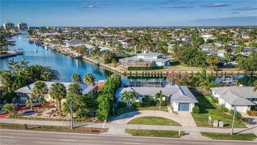 Aerial view of residential area with a nearby body of water
