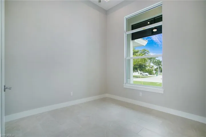 Spare room featuring light tile patterned floors
