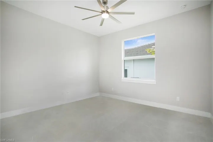 Unfurnished room featuring ceiling fan