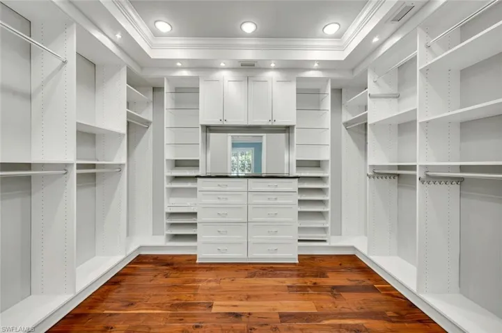 Walk in closet featuring hardwood / wood-style floors