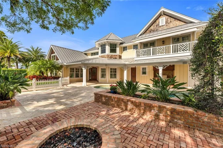 Back of property with a balcony