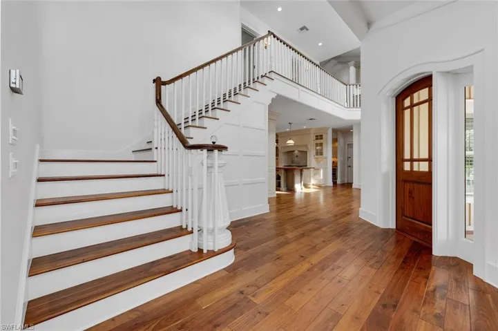 Foyer featuring ornamental molding and hardwood / wood-style flooring