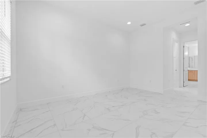 Primary bedroom features en suite bathroom and two walk-in closets.