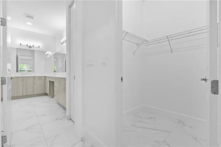 Two walk-in closets lead you into the primary bathroom.