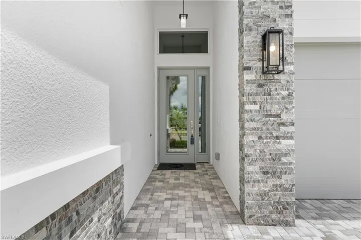 Entry features a beautiful glass entry door
