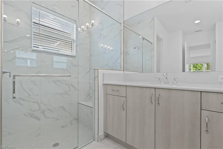 Beautifully tiled shower with natural light from window
