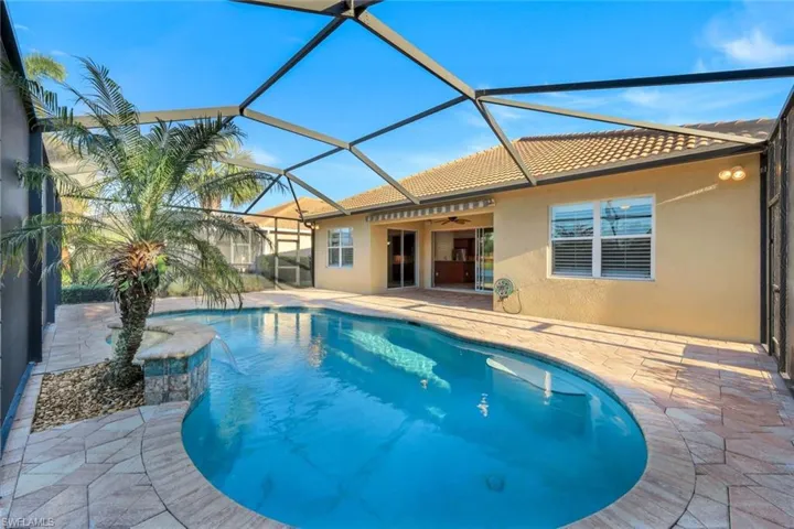 View of pool, ceiling fan, and a patio area