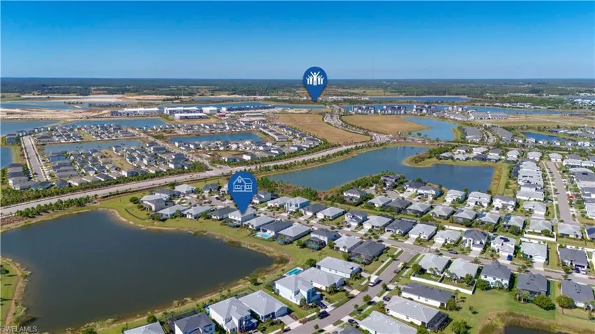 Aerial perspective showcasing a residential community with water features