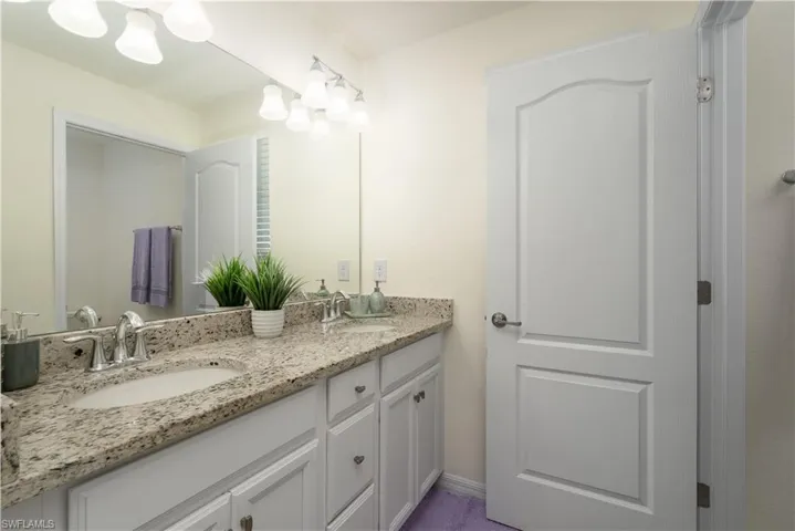 Dual vanity with undermount sinks and chrome fixtures